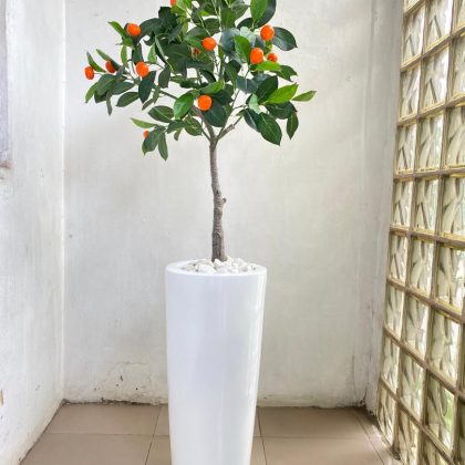 fiberglass vase potted with an artificial orange tree