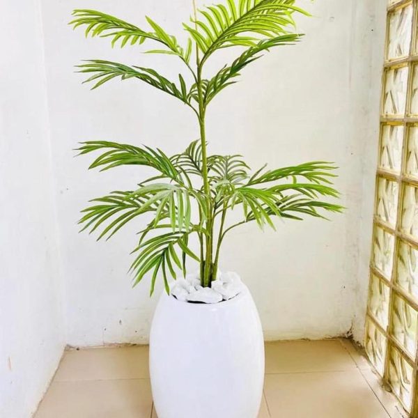 Add a touch of tropical elegance to your home or office with the Artificial Single Stem Palm, potted in a Classic Fiberglass Vase.