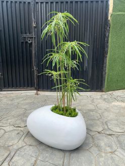 Transform Your Décor with a Pebble Pot: The Elegance of Fiberglass and Artificial Plants