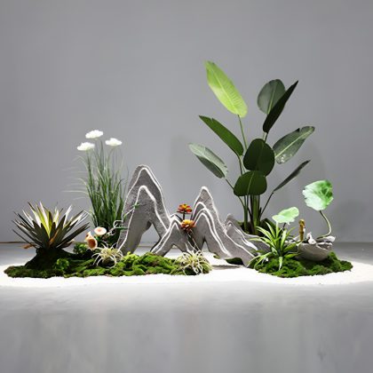 Modern Tropical Indoor Hotel Landscaping Design with Artificial Plants – 2.6x1.2x1.5m Natural Luxury Create an immersive green experience in your hotel space with this modern tropical indoor hotel landscaping design, measuring 2.6m (L) x 1.2m (W) x 1.5m (H). This visually striking installation is built with high-quality artificial plants, lush artificial moss, and sculptural rock formations, bringing the outdoors inside—without the maintenance. Lifelike Artificial Plants for a Vibrant Green Backdrop Carefully selected artificial plants with a mix of broad leaves, tall stalks, and fine textures mimic the diversity of tropical flora. These maintenance-free elements remain lush all year round, enhancing your hotel's aesthetic with no need for watering, sunlight, or trimming. Indoor Hotel Landscaping Design: Artificial Moss – A Soft, Grounded Contrast A layer of realistic artificial moss blankets the base of the landscape, adding depth and organic texture. The vivid green tones of the moss bring natural softness and help tie the installation together in a cohesive, earth-inspired look. Sculptural Artificial Rock for Visual Balance Custom-shaped artificial rocks provide height contrast and grounding structure within the composition. Their natural finish adds a rugged elegance that contrasts beautifully with the soft greenery and enhances the installation’s realistic appearance. Why Choose This Indoor Hotel Landscaping Design? This indoor hotel landscaping design is ideal for luxury environments seeking ambiance, freshness, and modern organic beauty without the burden of live plant care. Key benefits include: Durable, high-quality artificial components Long-lasting beauty with no seasonal changes Allergy-free, pest-free, and easy to clean Perfect for lobbies, lounges, hallways, and reception zones Enhances guest experience and visual appeal Best Placement Areas for the 2.6x1.2x1.5m Installation Thanks to its compact yet eye-catching dimensions, this design is ideal for: Hotel reception backdrops Lounge area partitions Indoor garden corners Event or photo backdrops Hallway installations Its modular build allows easy repositioning or integration into larger architectural features. Conclusion: Elevate Your Space with Effortless Indoor Nature Bring lasting tropical serenity to your interiors with the Modern Indoor Landscaping Design – 2.6x1.2x1.5m. This curated blend of artificial plants, moss, and rock delivers timeless, natural elegance for luxury environments where first impressions matter most.